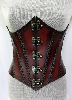 It is handmade leather underbust corset with hand-sewn leather detailing. It's adjustable back side with buckles. We used about 2 to 2.2 mm thick handmade leather. It is hand dyed handmade leather. It is crazy for medieval events and Larp.   Corset is hand made from sturdy top-grain leather.  Size is available from 30 to 46 inch, please check our size chart. DETAILS: ► 100% Handmade ► 100% Genuine leather ► Made on your measurements ► Unique design ► LARP standard ► Worldwide delivery Usually it Brown Gothic Corset Belt For Cosplay, Gothic Leather Corset Belt, Steampunk Leather Corset For Cosplay, Steampunk Underbust Corset Belt For Fantasy Events, Gothic Corset With Belt For Cosplay, Gothic Brown Corset For Costume, Gothic Brown Corset For Festival, Brown Gothic Corset For Costume, Steampunk Corset With Corset Back For Larp