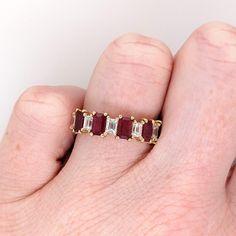 This beautiful band ring features five emerald-cut ruby gemstones of 1.56-carat weight with six natural earth-mined diamonds, all set in solid 14K gold. This band ring is made with solid 14K Gold and natural Earth mined SI / G-H diamonds. As listed, this ring is ready to ship. If you're interested in purchasing this setting with a different center stone please message us! Ruby Band Ring, Designer Silver Jewellery, Ruby Bands, Jewelry Showcases, Ruby Gemstone, Red Ruby, Natural Earth, Diamond Band, Earring Findings