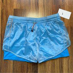 Nike Shorts Size: Xl Ships Same Day Or Next! Nike Blue Nylon Bottoms, Nike Nylon Beach Bottoms, Light Blue Nylon Bottoms For Summer, Nike Orange Short Bottoms, Nike Orange Shorts, White Running Shorts, Grey Nike Shorts, Nike Running Shirt, Nike Tempo Shorts