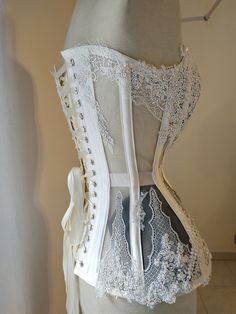 "✨\"Night Jasmine\"✨ corset, the second born out from my new collection 🌸\"Flower Couture\"🌸. . It's a plungie steelboned corset made in white cotton satin and mesh, decorated with delicate and beaded quality lace. All lace is handsewn and It's surely a piece of Haute Couture. It's made to order on your personal measures, so please, before placing an order count at least 3 weeks to be ready to ship. ------------------------------------------------------------- Facebook: https://www.facebook.co Flower Couture, Night Jasmine, Victorian Lingerie, Lingerie White, White Corset, Gothic Victorian, Underbust Corset, Victorian Rings, Lace Corset