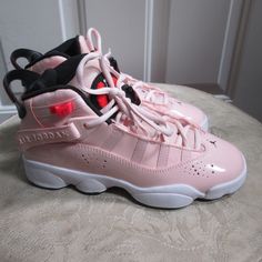 No Original Box. Brand New, Never Been Used Pale Pink Patent Leather In Color Bought In Nordstrom Rack Forgot To Return And Had Expired The Due Date Of Return. Please Ask Questions The Air Jordan 6 Rings Atmosphere (Gs) Is A Stylish And Iconic Basketball Shoe By Jordan. Designed Specifically For Youth, These Shoes Offer A Comfortable Fit And Excellent Performance On The Court. With The Classic Air Jordan Style And The High-Quality Craftsmanship, These Sneakers Are Perfect For Young Basketball En Pink Leather Basketball Shoes With Round Toe, High-top Synthetic Jordan Shoes With Air Cushioning, Pink Jordan Shoes With Cushioned Footbed, Sporty Pink Jordan Shoes, Pink Jordan Shoes With Round Toe For Sports, Pink Basketball Shoes With Round Toe, Pink Basketball Shoes, Air Jordan 6 Rings, Pink Basketball