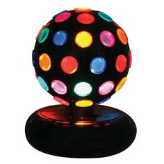 a colorful light up ball sitting on top of a table