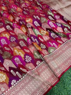 This is a very beautiful pure banarasi kataan silk handloom saree . Floral cutwork jangla body , Rangkaat weave , golden and silver zari , Meena border with blouse . Saree length - 5.5 mtr. Blouse - 1 mtr.  Dry clean only . Please note - color may be vary a little due to sunlight and photography . Please message us after purchasing in case you want fall and Pico done it not . No extra charges for fall and Pico but inform us . Blouse stitching is also available . Multicolor Banarasi Silk Dupatta With Self Design, Multicolor Katan Silk Dupatta With Self Design, Multicolor Self Design Katan Silk Dupatta, Multicolor Self-design Katan Silk Dupatta, Multicolor Katan Silk Saree With Self Design, Multicolor Paithani Silk Dupatta With Self Design, Multicolor Katan Silk Lehenga With Zari Weaving, Multicolor Self Design Banarasi Silk Saree, Multicolor Banarasi Silk Saree With Self Design