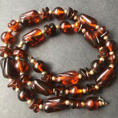 Vintage Tortoise Shell Beaded Necklace 1960's 1970's Jewelry Measurements Length - 22 1/2 inches In very good vintage condition. A nice addition to any collection. D201 Vintage Jewelry With Large Round Beads, Vintage Amber Jewelry With Large Beads, Large Vintage Beads For Jewelry Making, Vintage Brown Adjustable Necklace, Adjustable Brown Vintage Necklace, Vintage Round Bead Necklaces Collectible, Vintage Jewelry With Polished Oval Beads, Retro Jewelry With Faceted Beads, Vintage Hand-strung Beaded Necklaces Gift