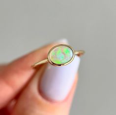 14K Yellow gold ring with Australian Crystal Opal Size: 7.25 Opal size: 8x6mm (0.5 ct) Metal: 14K yellow gold Band: 1mm Stones: Australian opal (natural untreated stone)   We offer complimentary sizing for most of our 14K gold rings, so please email us to inquire before placing an order. Crystal Opal, 14k Gold Ring, Australian Opal, Opal Crystal, Yellow Gold Ring, Gold Band, Yellow Gold Rings, Rings Statement, Gold Bands