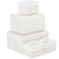 three white baskets stacked on top of each other