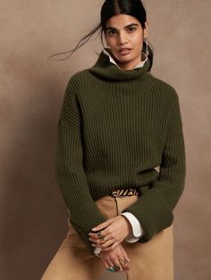 Dimensional and dynamic, this oversized sweater is expertly cut for a boxy fit with wide sleeves that play with proportions.  Take note: the high-slits at the sides allow you to show off high-waisted styles.  MERINO & CASHMERE: Weighty and warm, supe Beautiful Wardrobe, High Waist Fashion, Green Olive, Green Sweater, Wide Sleeves, Funnel Neck, Oversized Sweater, Cashmere Sweater, Cuff Sleeves