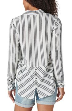 Update your everyday wardrobe with this striped button front shirt that features an eye-catching back button hem. 27" length (size S) Spread collar Long sleeves Front button closure Chest pocket All-over stripe Woven 53% cotton, 47% viscose Machine wash cold, tumble dry low Imported Model stats: 5'10", 32" bust, 25" waist, 36" hip. Model is wearing size S. Button Front Shirt, Everyday Wardrobe, Chest Pocket, Lucky Brand, Nordstrom Rack, Button Down Shirt, Long Sleeve Blouse, Nordstrom, Long Sleeves