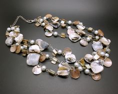 This elegant Boho design 3-strand necklace is made with free form mother of pearl shell beads and pearl imitation spacer beads, hand strung on silver tone metal. 70's Gipsy style vintage costume jewelry item. The necklace will be shipped in a gift box. The necklace length is variable from 18 inches to 20 4/5 inches (45 cm to 52 cm) Weight of the necklace: 118 grams. Excellent vintage condition. On the last photo you can see this necklace with other matching mother of pearl necklace, which you ca Victorian Style Jewelry, Pearl Bead Necklace, Red Pendants, Layered Necklace Set, Mid Century Jewelry, Mother Of Pearl Necklace, Boho Design, Shell Necklace, Boho Designs