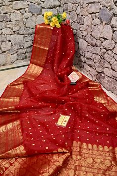 An elegant collection with fine traditional zari weaving on the body, pallu, and border- with golden paisley motif zari buti on the body and kadhua style zari work on the border makes this chanderi banarasi saree one of the magnetic works in royal red color. Color: A shade of dark red color Technique: Amazing work of traditional zari golden butta work all over the saree Fabric: Chanderi Quality: Indyvogue's Assurance of Pure Silk Mark Certified Saree Dark Red Color, Paisley Motif, Work Online, Color Techniques, Zari Work, Banarasi Saree, Saree Fabric, Royal Red, Work Sarees