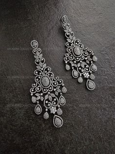 Statement chandelier earrings with an intricate Victorian design. Made with highest quality CZ diamonds and expert craftsmanship. Ideal for weddings and parties. Length - 4.25 inch Width - 1.75 inch Weight - 23 gm each ----------- CARE ----------- - Store in air tight zip lock bags - Do not expose to moisture/water - Do not spray chemicals or perfumes on the jewelry Please feel free to contact us if you have any questions. * We sell high quality imitation jewelry only. All measurements are approximate. Please note that all sales are final. Thank you Diamond Earrings Indian, Ad Earrings, Statement Chandelier, Pakistani Jewellery, Jewelry Pakistani, Victorian Earrings, Statement Chandeliers, Earrings Chandelier, Earrings Indian