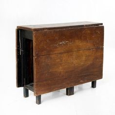 an old wooden cabinet with two doors open