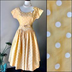 "1950s Polka Dot Dress in Yellow and White B Siegel Co Detroit Belted Drop Waist Full Skirt Flattering Fit Wonderful Silouette Classic Design This dress is really fabulous. It has a waist and belt combination that you don't see very often. The fabric is light and comfy. Amazing with a crinoline underneath.  Condition is very good. There are a few very small and light marks on the back. Almost look like pencil. See photos. The belt is in good condition. The buckle has discoloring which may be rus Love Hat, Dropwaist Dress, 50s Fashion, Drop Waist, Polka Dot Dress, Dot Dress, Full Skirt, Classic Design, Polka Dot