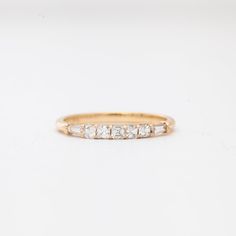 Step back in time with this new band by San Francisco-based Porter Gulch. Featuring a glittering row of asscher cut white diamonds flanked by two tapered baguettes, the Constance is an Art Deco lover's dream. Pair it with an engagement ring or add it to any ring stack that needs a touch of sparkle. Made in San Francisco. All sizes made to order within 4-6 weeks. To inquire about different metals, sizes, or custom center stones, contact us. 14 karat gold with five asscher cut white diamonds and t Ring Stack, Asscher Cut, New Bands, Step Back, Baguette Diamond, Back In Time, White Diamonds, Diamond White, Diamond Shapes