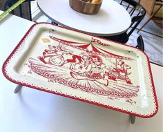 a red and white tray sitting on top of a table