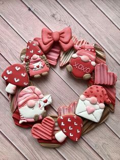 decorated cookies arranged in the shape of santa claus and other christmas decorations on a wooden table