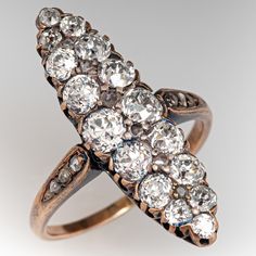 This lovely circa mid-to-late Victorian era silver topped 14k yellow gold ring. The navette shaped gallery is accented with sixteen (16), semi-bezel/bead set, old European cut diamonds and six (6), bead set, rose cut diamonds. The shoulders of the ring are each accented with three (3), bead set, rose cut diamonds. The ring measures 26.2mm at the top, rises 5.5mm above the finger, tapering to 1.4mm wide and 0.8mm thick at the base of the shank. It is currently a size 7. A few of the accent diamonds are chipped but this is not visible without magnification. Antique Marquise Rose Cut Diamond Ring, Victorian Marquise Yellow Gold Diamond Ring, Victorian Marquise Diamond Cut Ring, Antique Marquise Diamond Ring, Antique Marquise Rings With Rose Cut Diamonds, Antique Marquise Cluster Ring For Wedding, Antique Marquise Cluster Wedding Ring, Antique Marquise Jewelry, Victorian Marquise Diamond Ring With Single Cut Diamonds