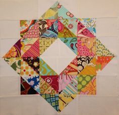 a colorful patchwork piece is displayed on a white background with the square in the center