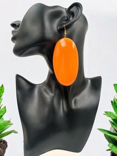 Add a pop of colour to your look with these bold orange wooden statement dangle earrings. Handcrafted with care, these earrings are perfect for anyone looking to make a fashion-forward statement. Their vibrant orange color adds a fun, energetic vibe, making them perfect for casual outfits or a night out. These earrings are not only stylish but eco-friendly, crafted from natural wood materials with hypoallergenic hooks for comfort. Material: Wood Colour: Orange Drop:10cm/3.9Inches Width:4cm/1.5 I Vibrant Orange Drop Earrings, Vibrant Orange Summer Earrings, Trendy Handmade Orange Earrings, Bold Orange Drop Earrings, Wood Colour, Orange Earrings, Colour Orange, Etsy Earrings Dangle, Vibrant Orange