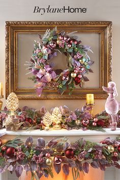 a mantel decorated with christmas decorations and wreaths