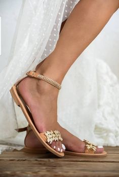 💓 Handmade genuine Greek leather wedding sandals decorated gold or silver. The embellishments are hand sewn onto the leather straps / For brides dreaming of a beach wedding, a Bachelor party or even a city wedding. SIZE CHART EUUSUK 354,52 (21-21,5 cm) 3653 (22-22,5 cm) 3764 (23-23.5 cm) 3875 (24-24.5 cm) 3986 (25-25.5 cm) 4097 (26-26.5 cm) 41108 (27-27.5 cm) 42119 (28 cm) 431210 (29 cm) Full sizes only ** If you have half the size, go UP to the nearest full size ** If you are unsure of your si Gold Round Toe Wedding Shoes For Summer, Gold Closed Toe Sandals With Rhinestones, Wedding Sandals With Rhinestones And Round Toe, Wedding Heels With Rhinestones And Single Toe Strap, Gold Sandals With Rhinestones And Ankle Strap, Gold Sandals With Rhinestones And Flat Heel, Gold Flat Heel Sandals With Rhinestones, Gold Open Toe Wedding Shoes With Rhinestones, Gold Toe Post Sandals For Party