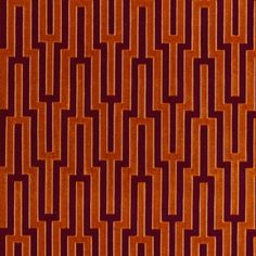 an orange and red rug with squares on it