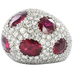 This voluminous dome ring is manufactured in platinum 950. The 6 certified, oval-cut rubies are of Mozambican origin and show no signs of any treatment. Total weight of the rubies is approximately 12 ct. The ring is completed with 233 brilliant-cut diamonds totaling approximately 3.50 ct of G/H-vs quality. The pave-set diamonds range from 0.005 to 0.05 ct. Ring size: 52.5, US 5 7/8 Maker's mark: ROM Stock no. 1000110480 Ring My Bell, Bracelets Design, Ruby Diamond Rings, Platinum Diamond Rings, Contemporary Ring, Harry Winston, Colombian Emeralds, Expensive Jewelry, Ruby Jewelry