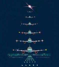 an airplane is flying in the sky with a christmas tree on it's side