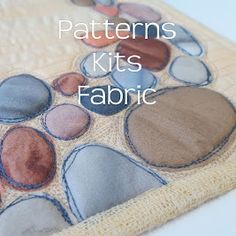 a close up of a piece of cloth with rocks on it and the words, patterns kits fabric