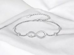 🌟 Embrace timeless elegance with our Rhodium Plated Infinity Bracelet! This stunning piece features a white gold plated finish that beautifully highlights the intricate infinity design. Crafted from high-quality copper, it's both stylish and durable, making it a perfect accessory for any occasion. ✨ 🔹 Material: Copper 🔹 Finish: White Gold Plated 🔹 Size: 17.5+5cm (Adjustable) 🔹 Weight: 3.12g 💫 The infinity symbol represents endless love and connection, making this bracelet a meaningful gift Elegant Infinity Bracelets For Formal Occasions, Elegant Infinity Diamond Bracelet For Formal Occasions, Silver Infinity Metal Bracelets, Elegant Infinity Metal Bracelets, Elegant Infinity Chain Bracelet Adjustable, Silver Infinity Diamond Bracelet For Anniversary, Formal White Gold Infinity Diamond Bracelet, Elegant Sterling Silver Infinity Chain Bracelet, Elegant Infinity Chain Bracelet For Anniversary