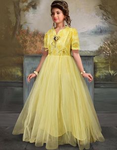 💫 Enhance your evening wardrobe with this versatile and exquisite Yellow Gown Rayon Soft Net! ✨🌟 #Fashionista #ChicStyle #StylishAndConfident #GlamorousGown #ArabicFashion #FashionGoals #ShopNow 👗💃 Fitted Short Sleeve Festive Gown, Fitted Ball Gown For Festive Occasions, Fitted Festive Ball Gown Dress, Festive Fitted Ball Gown Dress, Yellow Floor-length Wedding Dress, Fitted Anarkali Maxi Dress With V-neck, Yellow Fitted Long Gown, Spring Anarkali Fitted Gown, Yellow Fitted Anarkali Gown