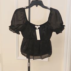 Super Versatile Piece! New With Tags! Top Can Be Worn On Or Off-The-Shoulder. Sheer, Shimmery-Sheen Like Fabric, Fully Lined, Except The Sheer Puff Sleeves. Black Satiny Colored Short-Sleeve Top. Pretty, Puffy Peplam, Short-Sleeved Crop Top. Elastic Band Under Bust, For A Feminine, Flattering Fit. Solid Black Top, With A Pretty Sheen. Organza Baby Doll Style, Short-Sleeved Blouse By Thirty-Thirty La. Square Style Neckline And Puff Sleeves Punch Up The Femininity Of This Gorgeous Top. Wear Along Silk Long Sleeve Blouse, Poncho Blouse, Tie Dye Crop Top, Printed Sleeveless Blouse, Animal Print Blouse, Blue Crop Tops, Chiffon Ruffle, Puff Sleeve Blouse, Sheer Chiffon