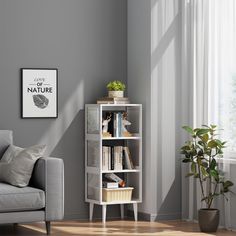 a living room with a couch, chair and bookshelf in front of a window