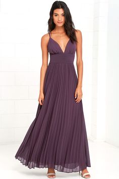 a woman in a long purple dress