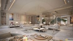 a living room filled with white furniture and lots of mirrors on the wall above it