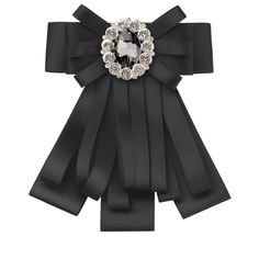 a black bow with a crystal brooch