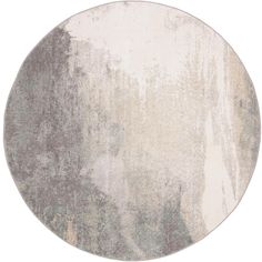 a round rug with grey and white colors