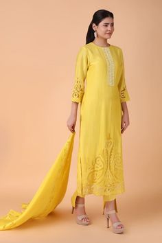 Yellow straight kurta with placement floral cutwork pattern. Paired with a pant and dupatta with floral cutwork pattern. - Aza Fashions Festive Semi-stitched Cutwork Kurta, Chikankari Embroidered Tissue Silk Straight Kurta Set, Elegant Tussar Silk Palazzo Set With Sheer Dupatta, Silk Sets With Chikankari Embroidery, Elegant Yellow Unstitched Suit, Elegant Slub Silk Lawn Suit With Chikankari Embroidery, Elegant Tussar Silk Palazzo Set With Chikankari Embroidery, Eid Tussar Silk Palazzo Set With Chikankari Embroidery, Silk Lawn Suit With Cutdana In Traditional Drape