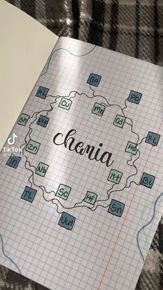 an open notebook with the word aria written in cursive writing on top of it