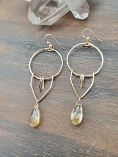 The Aria Earrings in Citrine are beautiful for the Spring/Summer months with its pretty light yellow color. A little sunshine to wear! Each piece is hand formed and lightly hammered for texture and shape. The length of the earrings are about 2 1/2 in. Each piece is handmade and may vary slightly as well as the stones. Thank you! Light Yellow Color, Pretty Lights, Summer Months, Light Yellow, Earring Necklace, Yellow Color, Citrine, Gold Filled, Dangle Earrings