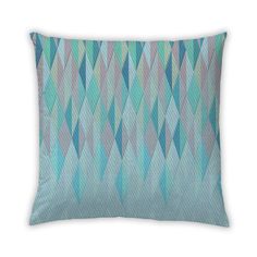 a blue and green pillow with an abstract design on it's back side,