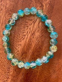 Super cute teal, aqua & clear stackable crackle glass bead bracelets. Would make great bridesmaids gifts or friendship bracelets. Beads are 8 mm in size with stretchy elastic fit. I also have 11 other colors to choose from or you can mix and match colors. Just specify in the personalization area or message me directly. This can also come as a wristlet keychain, hardware available in 5 different colors, for $3.00 extra. Customizable & personalizable. Free Shipping. Message me with any questions. Glass Beaded Bracelets For Party, Turquoise Crystal Bracelet With Faceted Beads As Gift, Glass Beaded Round Bracelets For Parties, Turquoise Czech Glass Jewelry For Party, Party Jewelry In Turquoise Czech Glass, Round Glass Beaded Bracelets For Parties, Turquoise Czech Glass Party Jewelry, Turquoise Faceted Beads Stretch Bracelet As Gift, Adjustable Turquoise Crystal Bracelet For Parties