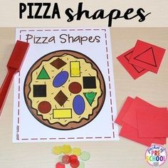 a piece of paper that has been cut out to make a pizza shape with shapes