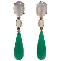 Discover these magnificent earrings in 18-carat yellow gold, a true work of art that harmoniously combines jade, tanzanite, chalcedony and emerald. Every detail of these earrings has been carefully designed to offer striking aesthetics and exceptional brilliance. 18-carat yellow gold, with its warm glow, creates a solid, luxurious base for these earrings. It also adds a touch of richness and elegance to the ensemble. The gemstones adorning these earrings are simply breathtaking. Jade, with its s Rose Gold Chandelier, Rose Gold Chandelier Earrings, Chandelier Contemporary, Pearl Chandelier Earrings, Emerald Earrings Drop, Diamond Chandelier Earrings, Gold Chandelier Earrings, Tanzanite Earrings, Jade Earrings