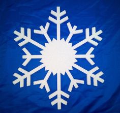 a white snowflake on a blue background