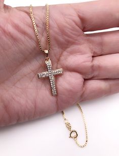 "Cubic Zirconia Cross Necklace Beautiful Cross 18k gold plating with zirconia encrusted. The cross measures 1.2 x 0.75 inch or 3 x 1.9 cm box 1mm chain. Details: 18K Gold Plated Pendant and chain Spring-ring clasp for closure Length 17.5\" inches or 45 cm It looks great alone or layering with other necklaces. It is carefully shipped in a beautiful organza pouch, bubble wrapped and well protected. A lot of my jewelry is made with silver plated and gold plated solid brass or any other metal. It wi Yellow Gold Cubic Zirconia Cross Necklace, Gold Diamond Crucifix Jewelry, Gold Jewelry With Vvs Clarity Cross Pendant, Gold Vvs Clarity Cross Pendant Jewelry, Gold Jewelry With Diamond Accents Cross Pendant, Gold Cubic Zirconia Crucifix Necklace, Gold Cubic Zirconia Cross Pendant Necklace, Gold Cross Pendant Jewelry With Diamond Accents, Cubic Zirconia Crucifix Necklace For Gift