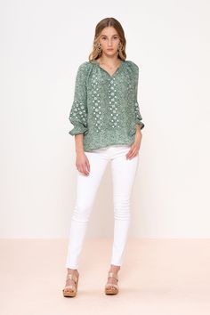 Transport yourself to the busy streets of Madrid in this très chic embroidered blouse. Show off a fun billowy sleeve, cinched with a geometric embroidered pattern while sightseeing around the city. Open V neckline blouse with contrast embroidered panels running down the front and circling the sleeve. Cinching at wrist finished with a petit fluted sleeve. Hook and eye closure at neckline. Generous fit. WE RECOMMEND SIZING DOWN. V Neckline Blouse, White Jeans Outfit, French Floral, Tie Sleeve, Tres Chic, Floral Print Tops, Red Blouses, Embroidered Blouse, Print Top