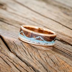 a wooden ring sitting on top of a wooden table