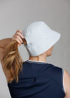 Very light-weight and breathable, you’ll forget you even have a hat on! An update to the High Ponytail Bucket Hat, the Tech features a reflective WM logo. The High Ponytail Tech Bucket Hat hat is a universal active hat that fits the needs of active women on all levels. Whether you’re going on a stroll in the park or golfing, this hat will keep your hair up and out of your way so your hair is the last thing you’ll need to worry about. These hats are specially designed by women with a unique back Wm Logo, Bucket Hat White, High Ponytail, Women's Headwear, High Ponytails, Active Women, Up Hairstyles, The Park, Gender Female