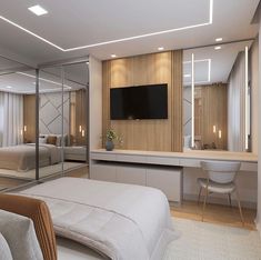 a bedroom with mirrored walls and white furniture